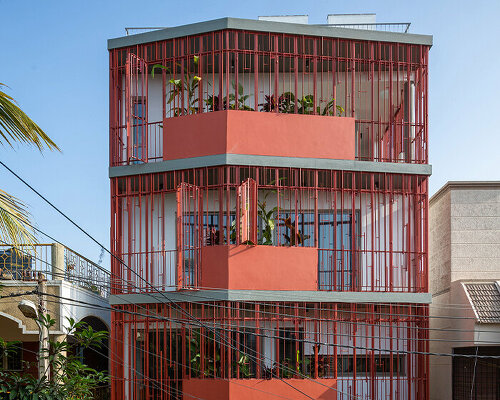 deep red-terracotta screens bring dynamic porosity to 'house on 46' in bangalore