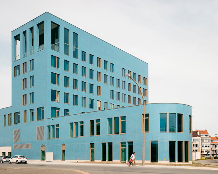 blue glass mosaic overlays maritime scientific research building in belgium