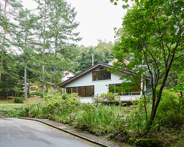 wooden interior completes the renovation of a villa hidden in the japanese forest