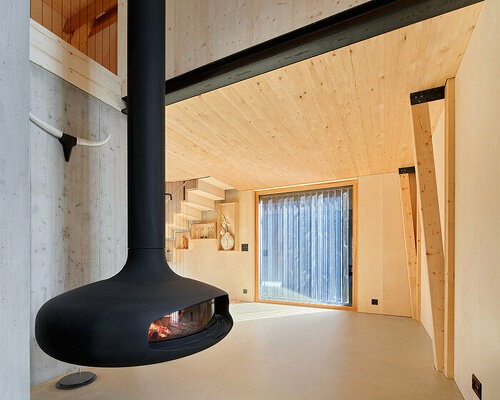 lukas lenherr transforms 1850s barn into residence with all-wood interior in switzerland