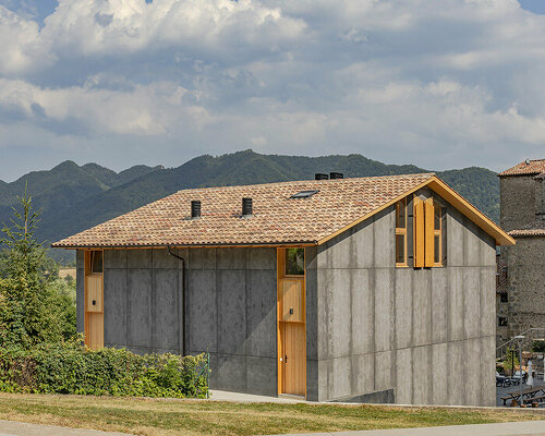 taller SAU elevates typical catalan farmhouse with concrete and timber 'vivet houses'