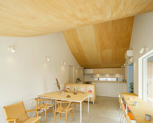 vaulted ceiling drapes over peaceful house + café by mikaduki architects in japan