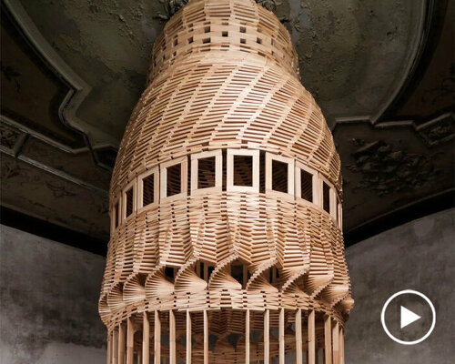 raffaele salvoldi shapes towering installations using 'thousands of planks, locked by gravity'