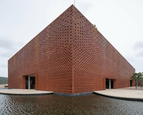 using bare bricks, MIA design studio shapes meditative club house along vietnamese coast