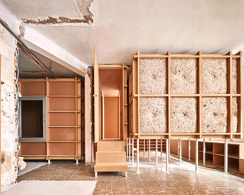 TAKK exposes old partitions + electrical installations in energy-conscious barcelona revamp