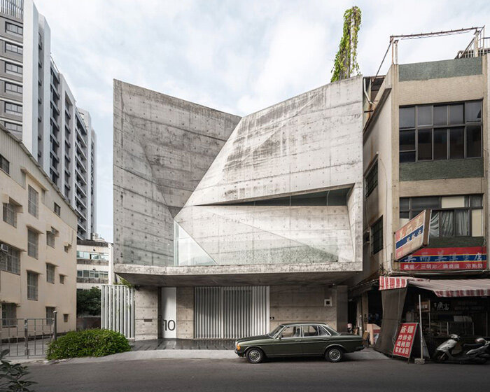 a folding concrete shell wraps the terraced gardens of atelier gratia's 'star house'