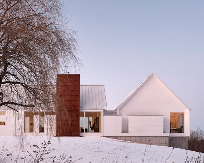 copper steel slabs of rural residence nod to the red earth of caledon badlands in canada