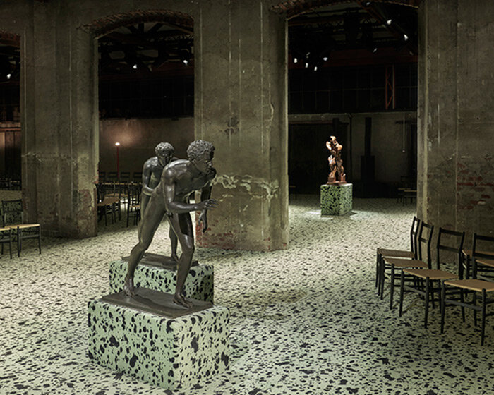 bottega veneta FW23 show unfolds among futurist boccioni statue & ancient roman bronzes