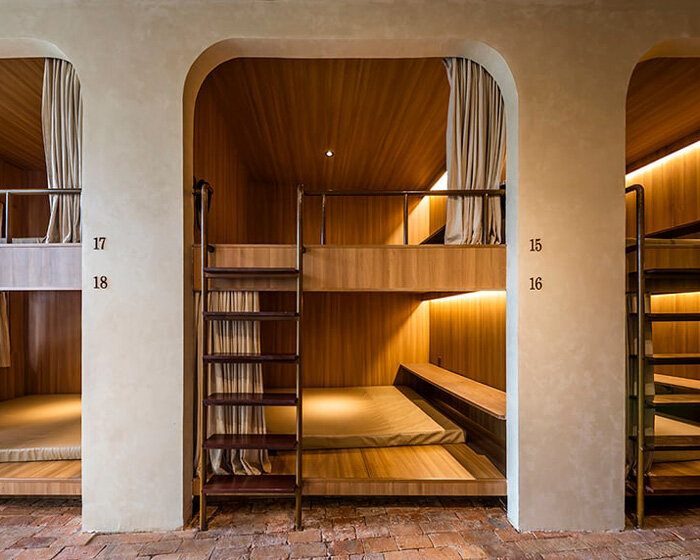 cavernous cafe in ho chi minh city invites visitors to sip a coffee in a bunk bed 