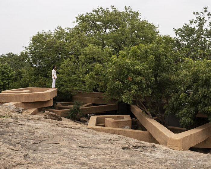 wallmakers' subterranean home in india reveals swirling layers of precast debris & waste