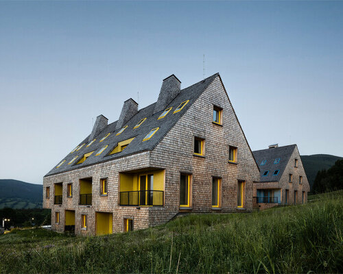 colored voids & glass mosaics adorn new apartment buildings in the czechian mountains