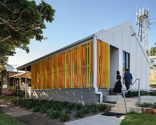 colorful timber screen with hidden morse code message decorates art gallery in australia