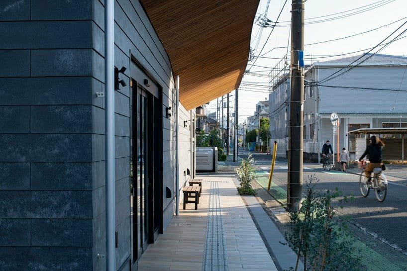 wavy wooden terraces overhang organically in japan