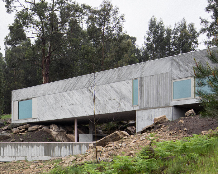 'tâmega' is a sculptural concrete home stretching horizontally across rugged land in portugal