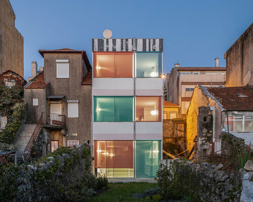 fala atelier fronts 'suspended house' in porto with a vibrant, asymmetrical design