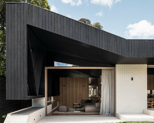 figr architecture studio’s charred timber shell shelters home in australia