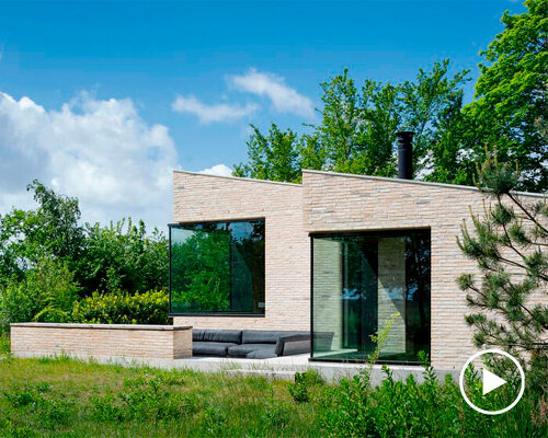 corner window frames pierce through yellow brick holiday retreat in the netherlands