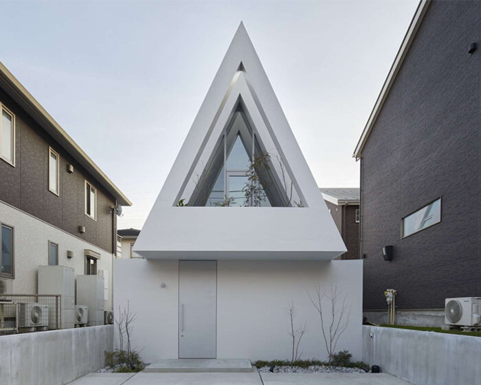 a triangular atrium crowns airhouse's new private residence in japan