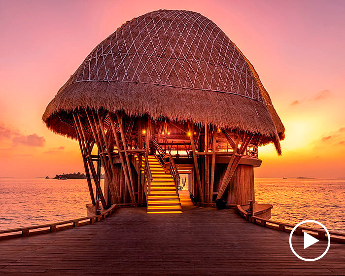 weaved bamboo roofs enclose pavilions for wellness resort in the maldives