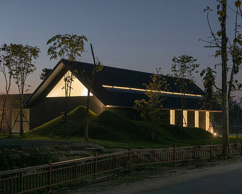 gabled longhouse showroom by sher maker celebrates artisanal woodworking in chiang mai