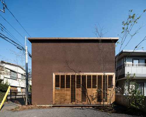 house in nakamachi plays with sunlight through reversible and sliding wooden shutters