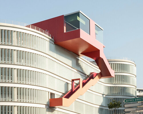 cantilevering red belvedere adorns new parking complex in chambéry, france