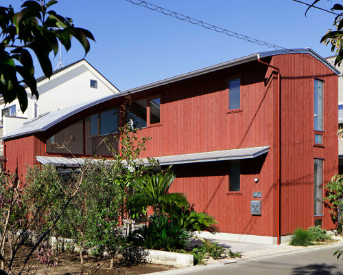 CASE-REAL tops deep red wood-clad house in tokyo with a silver roof