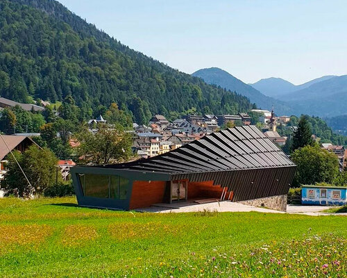 undulating tiered rafter by studio beltrame envelops ski school in italy