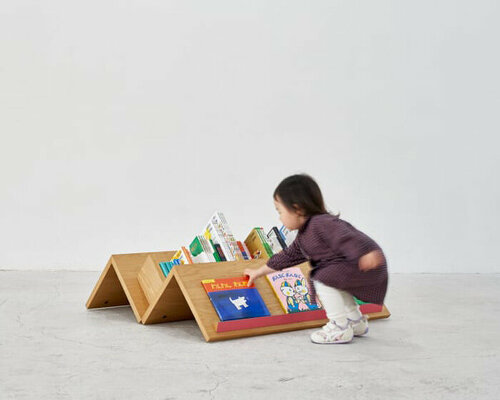 mobile bookshelf with mountain-shaped fixtures invites children to explore independently