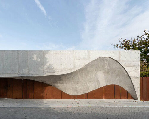 undulating concrete entrance adorns calujac architecture's family house in rural moldova