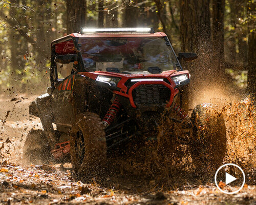 multi-terrain off-roader polaris RZR XP weathers steep hills, rough bumps, and muddy paths