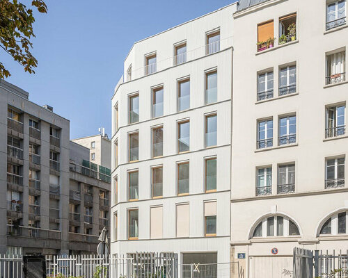 wooden residential complex reinterprets characteristic parisian suburban architecture