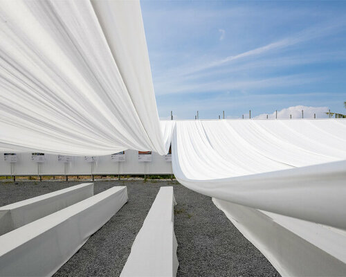 MIA design studio drapes rows of swaying white fabric over new ashui pavilion in vietnam