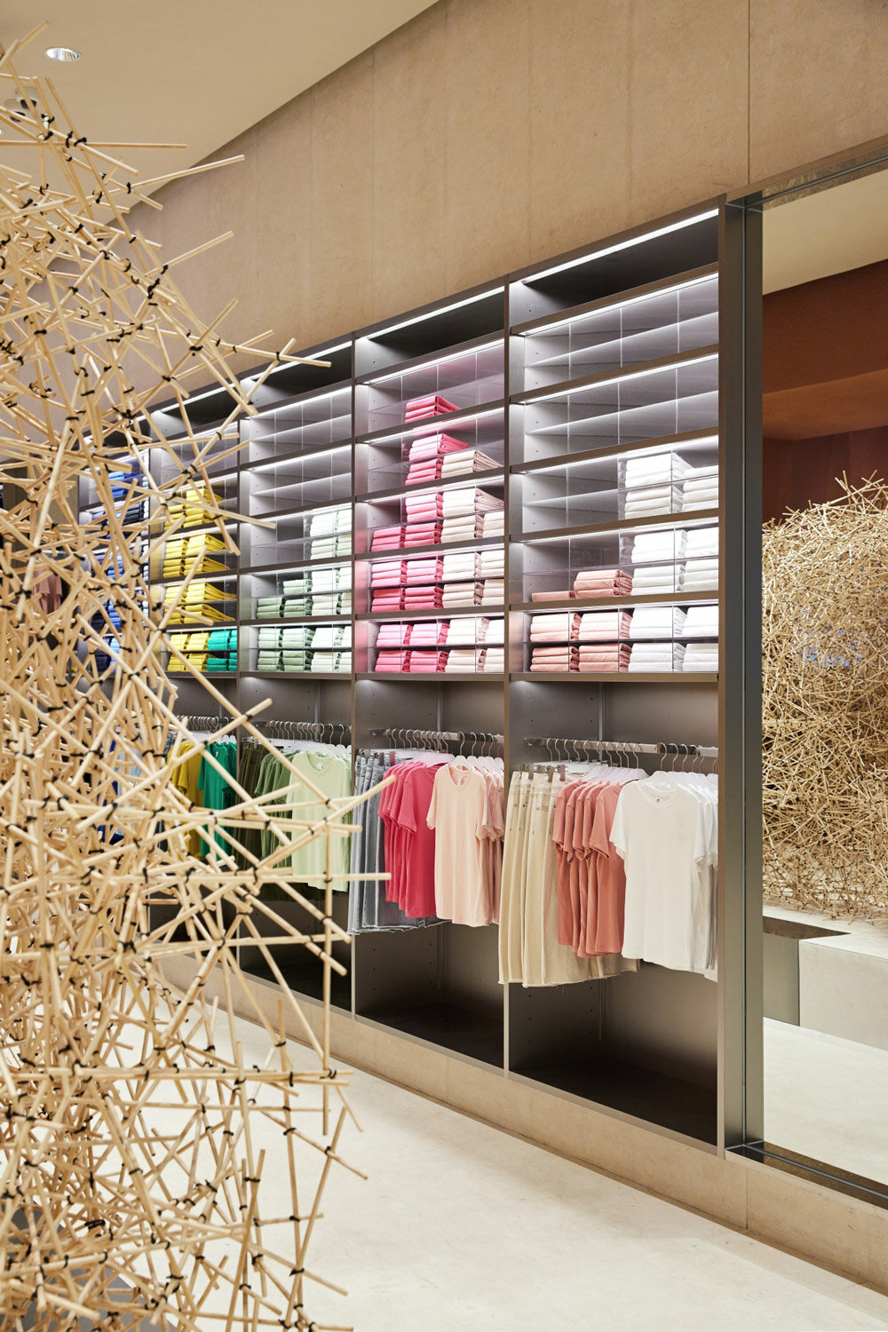 woven bamboo installation by AIM architecture drapes over fashion store ...