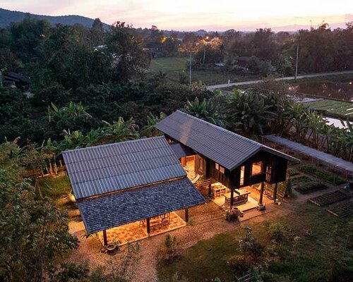 local wood joinery technique assembles roofed residence in northern thailand