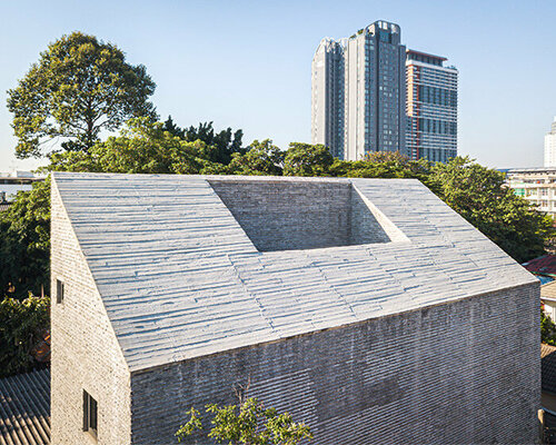 boonserm premthada's recycled brick residence in bangkok features 'reverse seam' façade