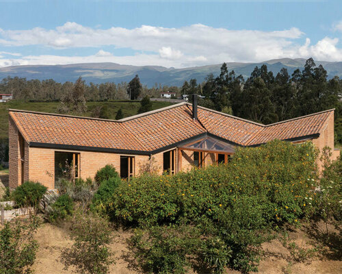 emilio lópez crowns 'casa alangasí' in ecuador with a folding tiled roof