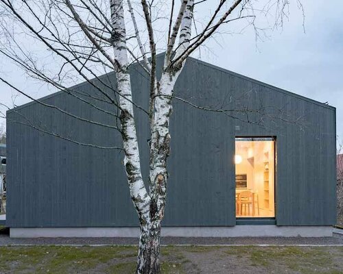 gray softwood boards contour the solid frame of 'delo house 4' in russia