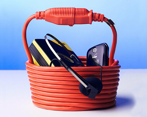 nik bentel wraps a single 25 ft electric cord into a statement bucket-shaped handbag 