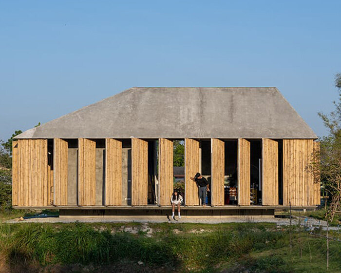 bamboo battens and discarded concrete spacers envelop art studio in thailand