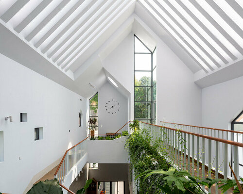 story architecture's lofty 'gather house' is flooded with sunlight in vietnam