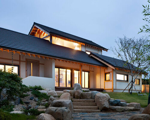 studio_GAON frames korean mountainous landscape through contemporary wooden hanok