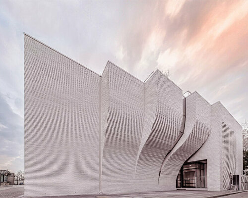 a curved brick wall ripples across LESS architects' office building design in seoul