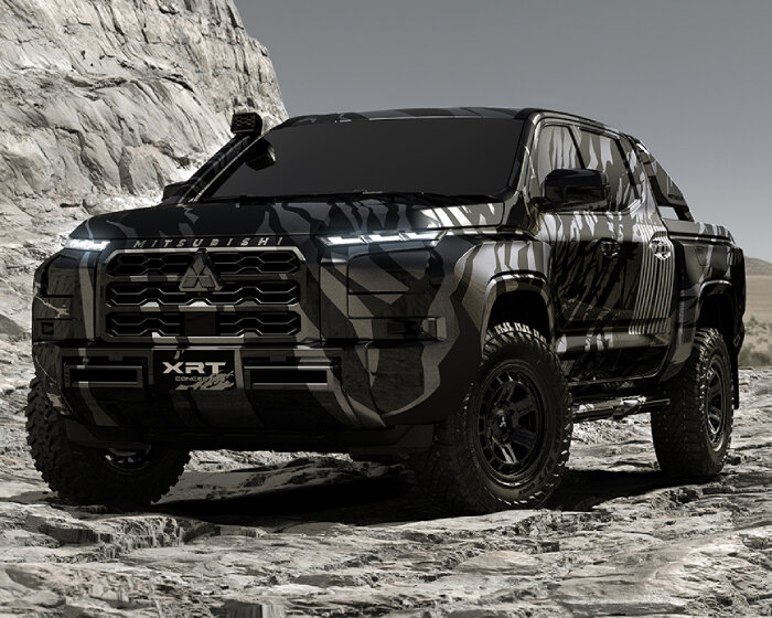 exterior of revamped mitsubishi triton 'XRT' reflects lava rocks post-eruption