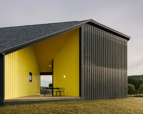 a striking yellow void punctuates scalar architecture's farm-like residence in the berkshires