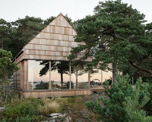 a house made of oak plank offcuts stands on the south coast of norway