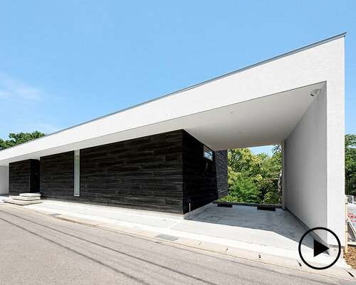 tatsuya kawamoto's asahigaoka house cantilevers over a steep slope in aichi