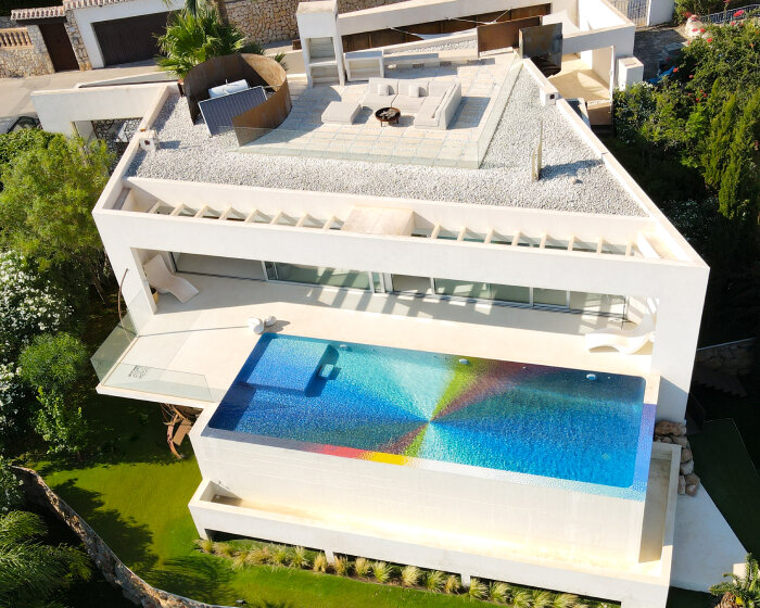 felipe pantone pixelates residential swimming pool with 130,000 rainbow glass mosaics