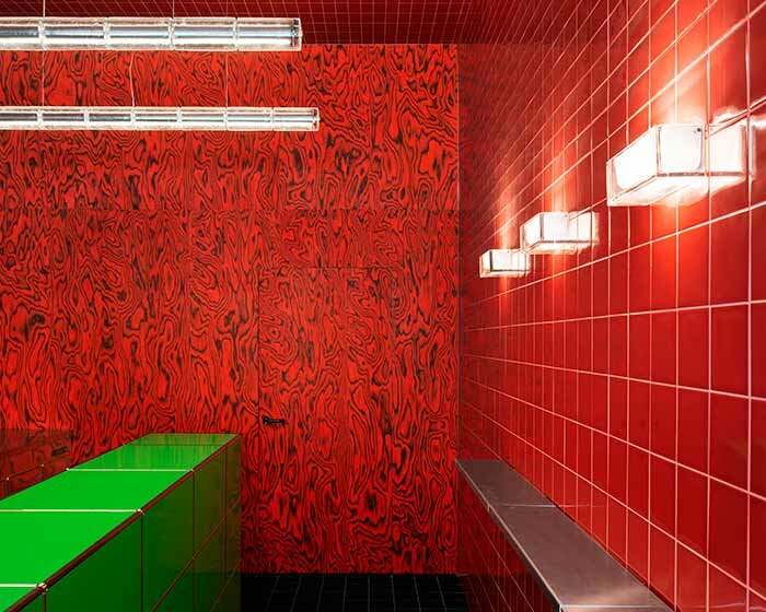 glossy red tiles contrast with lime green counter within spazio maiocchi's new bar in milan