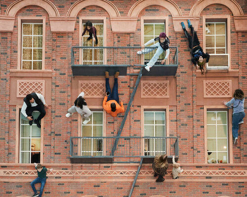 leandro erlich's surreal installation in NYC invites you to climb and explore a brick façade